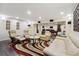 Inviting basement living area with comfortable seating, a pool table, and stylish decor, offering a cozy retreat at 2460 Due West Nw Cir, Kennesaw, GA 30152