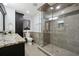 Bathroom with walk-in shower stall and granite countertops at 2460 Due West Nw Cir, Kennesaw, GA 30152