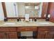 A bathroom showcases a double sink vanity with granite counters and a full suite of amenities at 2460 Due West Nw Cir, Kennesaw, GA 30152