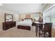 Bedroom featuring a desk and chair, bedside lamps, and dresser at 2460 Due West Nw Cir, Kennesaw, GA 30152