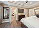 This bedroom features an ensuite bathroom and an entertainment center with a large flat screen TV at 2460 Due West Nw Cir, Kennesaw, GA 30152