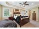 Lovely bedroom with a tray ceiling, neutral carpet, and a comfortable beanbag chair at 2460 Due West Nw Cir, Kennesaw, GA 30152