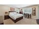 Bedroom with a small table and chairs, carpeted floor, and bedside lamps at 2460 Due West Nw Cir, Kennesaw, GA 30152