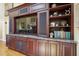 Custom built-in shelving and cabinets provide ample storage and display space at 2460 Due West Nw Cir, Kennesaw, GA 30152