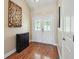 Inviting entryway with beautiful hardwood floors and a stylish accent piece at 2460 Due West Nw Cir, Kennesaw, GA 30152