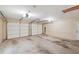 Spacious two car garage with two overhead doors, electrical, and lighting at 2460 Due West Nw Cir, Kennesaw, GA 30152