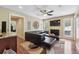 Comfortable living room with a large leather sectional, decorative artwork, and ample natural light from the window at 2460 Due West Nw Cir, Kennesaw, GA 30152