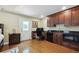 Cozy office area with wood floors, built-in cabinets, granite countertop, microwave and mini refrigerator at 2460 Due West Nw Cir, Kennesaw, GA 30152