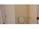 Small bathroom with a standard toilet, white walls, and white doors at 2502 Walden Lake Dr, Decatur, GA 30035