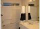 Bathroom featuring black and white shower curtain, a sink and large vanity mirror at 2502 Walden Lake Dr, Decatur, GA 30035