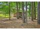 Lush backyard with a path leading to a deck and fenced yard providing serene privacy at 4035 Woodbridge Ct, Powder Springs, GA 30127