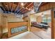 Finished basement area with a bar and wood-paneled wall detail, perfect for entertaining at 4035 Woodbridge Ct, Powder Springs, GA 30127