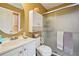 Bathroom featuring a round mirror, modern vanity, and frosted glass shower at 4035 Woodbridge Ct, Powder Springs, GA 30127