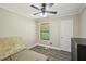 A clean bedroom features light walls, ceiling fan and laminate floors at 4035 Woodbridge Ct, Powder Springs, GA 30127