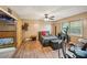 Bedroom with ample sunlight, ceiling fan, and laminate wood flooring at 4035 Woodbridge Ct, Powder Springs, GA 30127