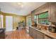 Bright kitchen with updated appliances, tile backsplash, and an adjacent dining area for easy entertaining at 4035 Woodbridge Ct, Powder Springs, GA 30127