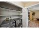 Convenient laundry area with modern washer and dryer units and extra storage space at 4035 Woodbridge Ct, Powder Springs, GA 30127