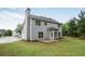 Spacious backyard with lush lawn, patio, and mature trees at 463 The Gables Dr, Mcdonough, GA 30253