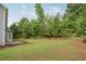 A view of the home's green backyard and trees, offering plenty of outdoor space at 463 The Gables Dr, Mcdonough, GA 30253