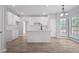 Bright, renovated kitchen featuring modern white cabinets, subway tile backsplash, and an eat-in island at 463 The Gables Dr, Mcdonough, GA 30253