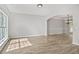 Spacious living room features new floors, neutral walls, and an open archway into the dining room at 463 The Gables Dr, Mcdonough, GA 30253