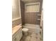 Cozy bathroom featuring a bathtub, tiled walls, and a classic vanity sink at 1234 Carolyn St, Marietta, GA 30062