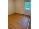 Bright bedroom featuring wood-look floors and a window providing natural light at 1234 Carolyn St, Marietta, GA 30062