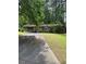 Charming single-story home with stone accents, a covered parking area, and a lush green lawn at 1234 Carolyn St, Marietta, GA 30062