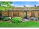 Backyard view of a brick exterior, with mature landscaping, a privacy fence, and air conditioning units at 1622 Executive Park Ne Ln, Atlanta, GA 30329