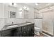 Bathroom features double sinks, granite countertops, and a shower with a glass enclosure at 1622 Executive Park Ne Ln, Atlanta, GA 30329