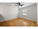 Neutral bedroom with hardwood floors, large window, and ceiling fan at 1622 Executive Park Ne Ln, Atlanta, GA 30329
