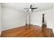 Large bedroom features hardwood floors, ceiling fan, closet space, and ensuite bathroom at 1622 Executive Park Ne Ln, Atlanta, GA 30329
