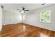 This bedroom features two large closets, a ceiling fan, hardwood floors, and lots of light from the bright windows at 1622 Executive Park Ne Ln, Atlanta, GA 30329