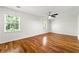 A spacious bedroom featuring a ceiling fan and bright windows which flood the space with natural light at 1622 Executive Park Ne Ln, Atlanta, GA 30329