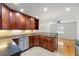 Updated kitchen featuring dark wood cabinetry, granite countertops, and stainless steel appliances at 1622 Executive Park Ne Ln, Atlanta, GA 30329