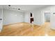 Living room with hardwood floors, modern track lighting, and view into the kitchen at 1622 Executive Park Ne Ln, Atlanta, GA 30329