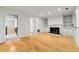 Open-concept floor plan with hardwood floors flowing from the living room to the kitchen at 1622 Executive Park Ne Ln, Atlanta, GA 30329