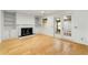 Cozy living room featuring a fireplace, built-in shelving, and sliding door to outdoor patio at 1622 Executive Park Ne Ln, Atlanta, GA 30329