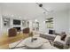 Bright living room with hardwood floors, built-in shelving, fireplace, and neutral decor at 1622 Executive Park Ne Ln, Atlanta, GA 30329