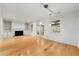Spacious living room featuring hardwood floors, fireplace, and sliding door to outdoor patio at 1622 Executive Park Ne Ln, Atlanta, GA 30329
