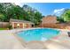 Community pool with sunning space, chairs, privacy fence, and restrooms at 1622 Executive Park Ne Ln, Atlanta, GA 30329