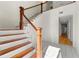 Bright foyer showcasing staircase with hardwood steps and decorative iron railing at 1622 Executive Park Ne Ln, Atlanta, GA 30329