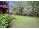 Expansive backyard with lush green lawn and mature trees, offering ample space for recreation and outdoor activities at 2855 Cedar Canyon Ct, Atlanta, GA 30345
