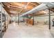Unfinished basement with exposed ceiling, perfect for storage or customization into a recreational area at 2855 Cedar Canyon Ct, Atlanta, GA 30345