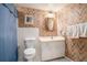 Bathroom featuring patterned wallpaper, a vanity, and a shower-tub combination, creating a vintage aesthetic at 2855 Cedar Canyon Ct, Atlanta, GA 30345