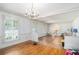 Bright dining area with hardwood floors, decorative trim, and access to other rooms at 2855 Cedar Canyon Ct, Atlanta, GA 30345