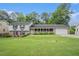 Charming home with a brick and white facade, a well-manicured lawn, and a welcoming front porch at 2855 Cedar Canyon Ct, Atlanta, GA 30345