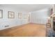 Spacious living room featuring hardwood floors, fireplace, and classic wall paneling at 2855 Cedar Canyon Ct, Atlanta, GA 30345