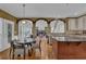 Spacious kitchen and dining area with hardwood floors open to the living room at 3305 Millwater Xing, Dacula, GA 30019
