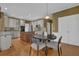Charming kitchen featuring stainless appliances, an island, and a dining table at 3305 Millwater Xing, Dacula, GA 30019